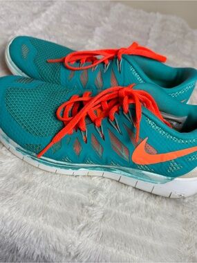 Nike Teal Sneakers with Bright Orange Accents